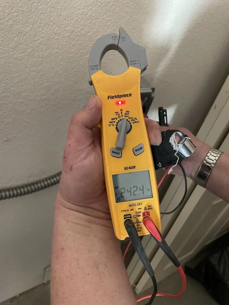 Voltage testing with clamp meter during Aluminum Wiring Replacement in Martin